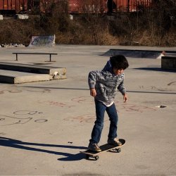 little kid riding his skateboard at foundation skate park